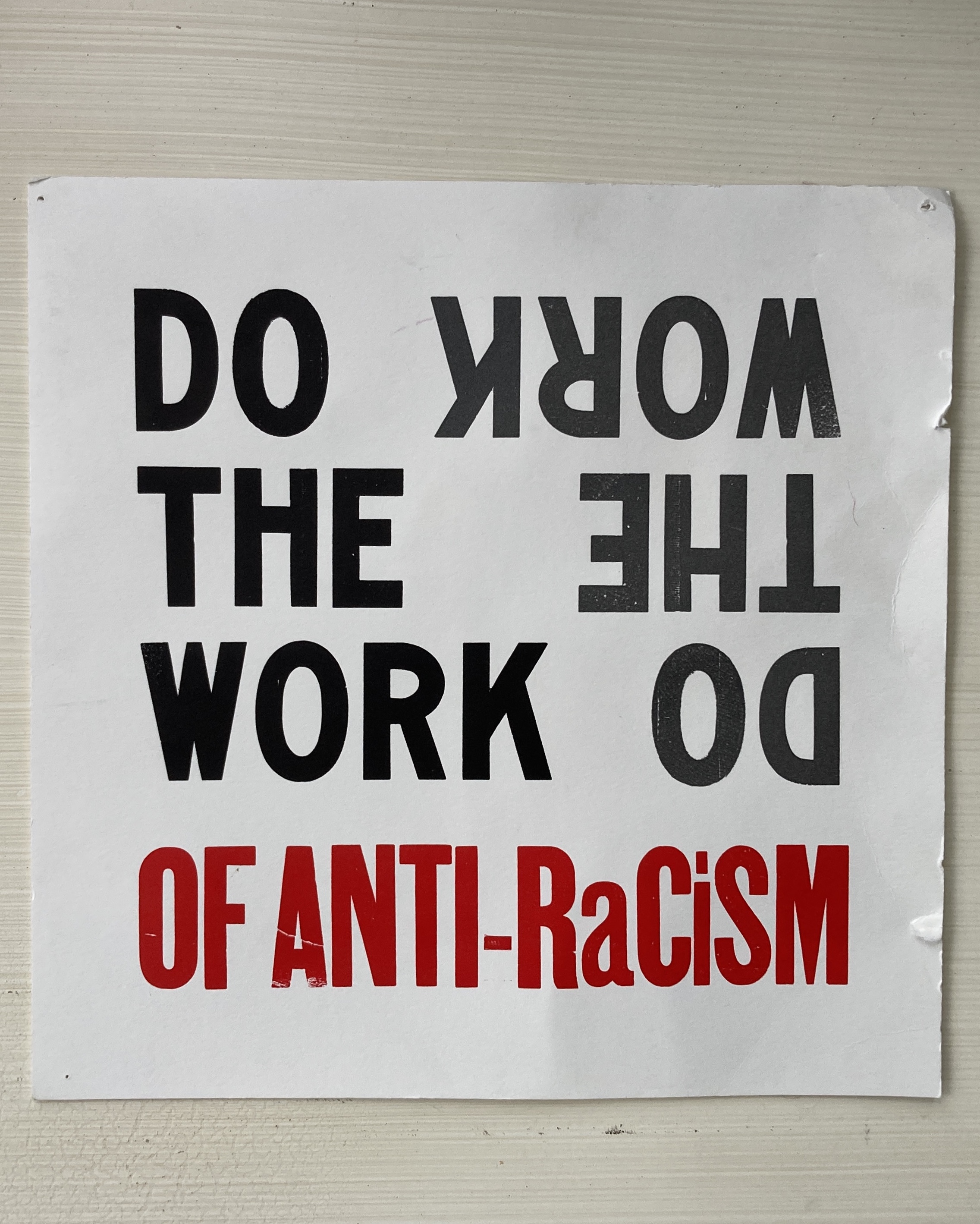 Square poster printed with the text Do the Work of Anti-Racism